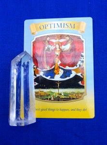 Optimism card on blue background.